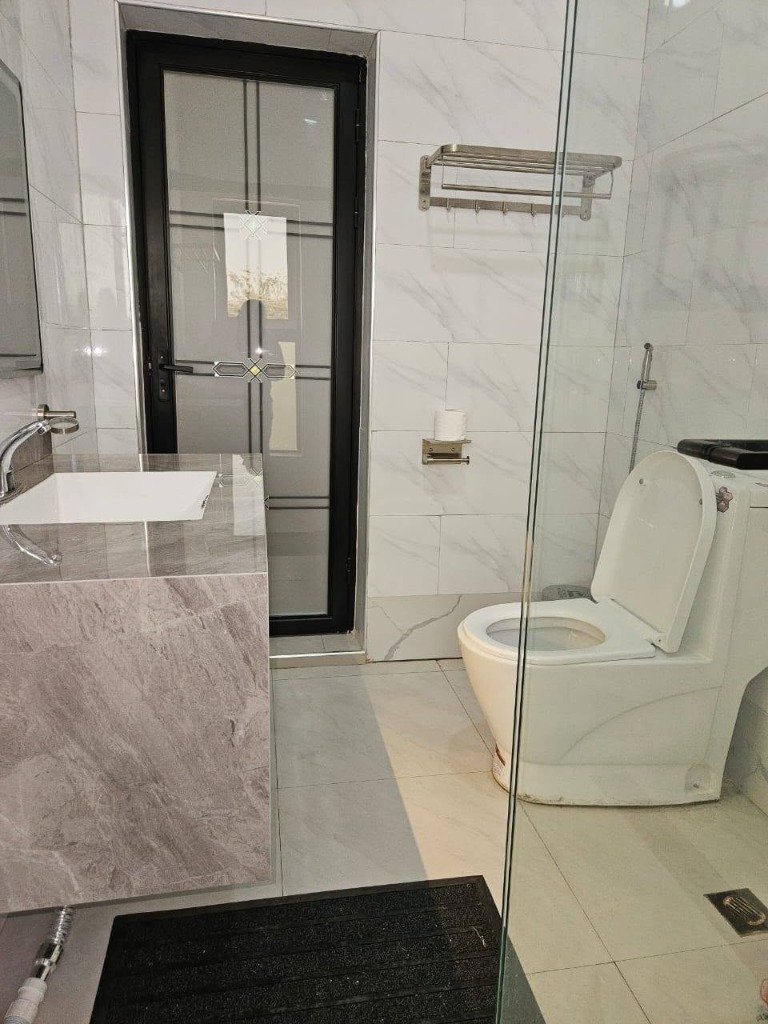 Executive Bathroom Sink and Toilet Area