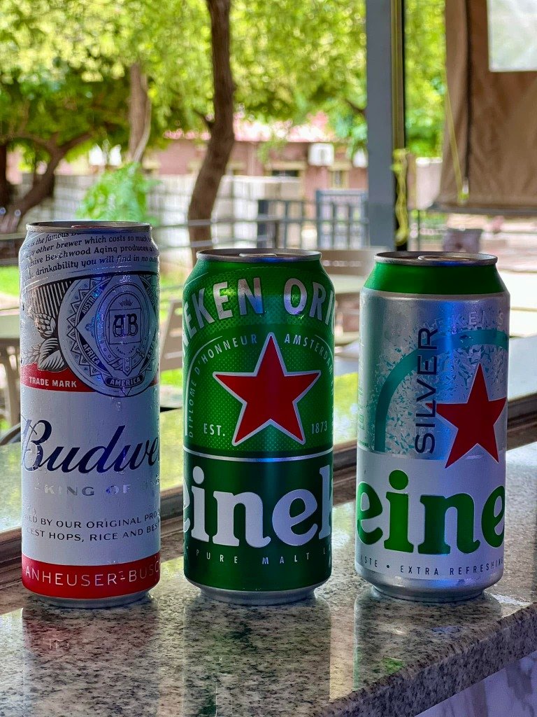 Ice Cold Budweiser and Heineken Beers on Bar Counter
