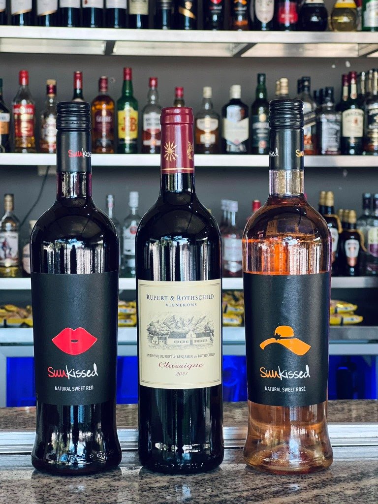 Sunkissed Sweet Red and Rosé Wines on Bar Counter