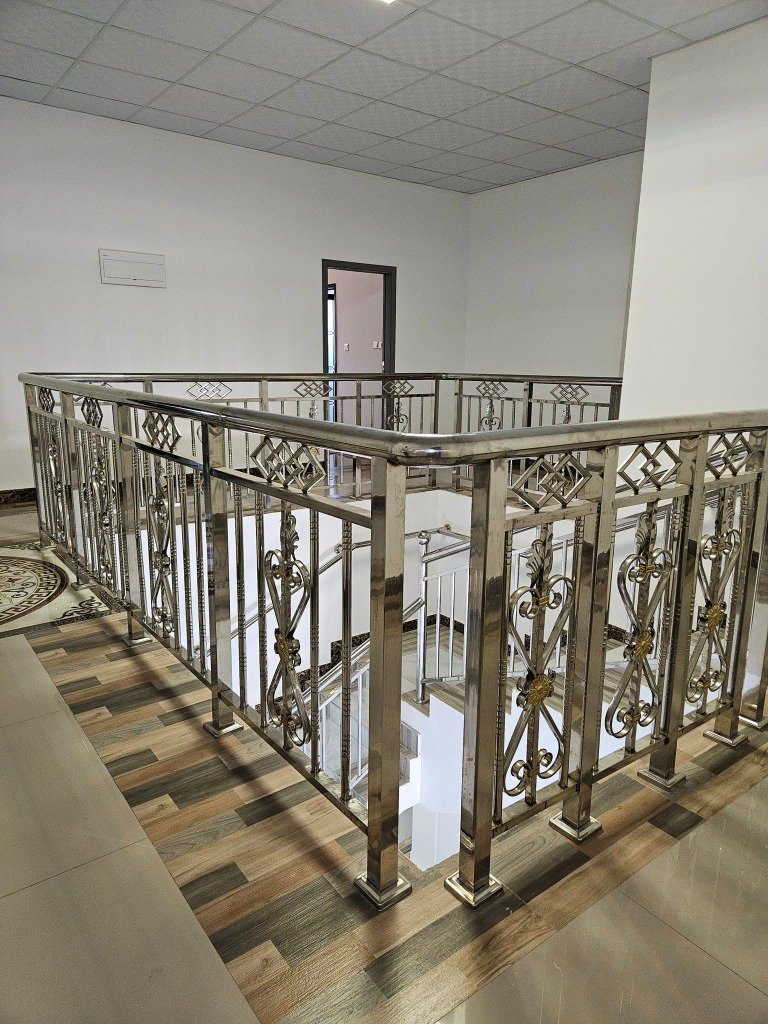 Lodge Staircase and Hallway with Stainless Steel Railing