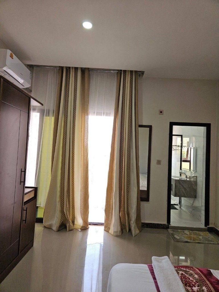 Lodge Room Interior showing Wardrobe and Balcony view